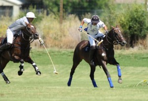 Roberto Zedda of Vaiente balances the ball in the air while avoiding a hook.  Photo by Louisa Davidson